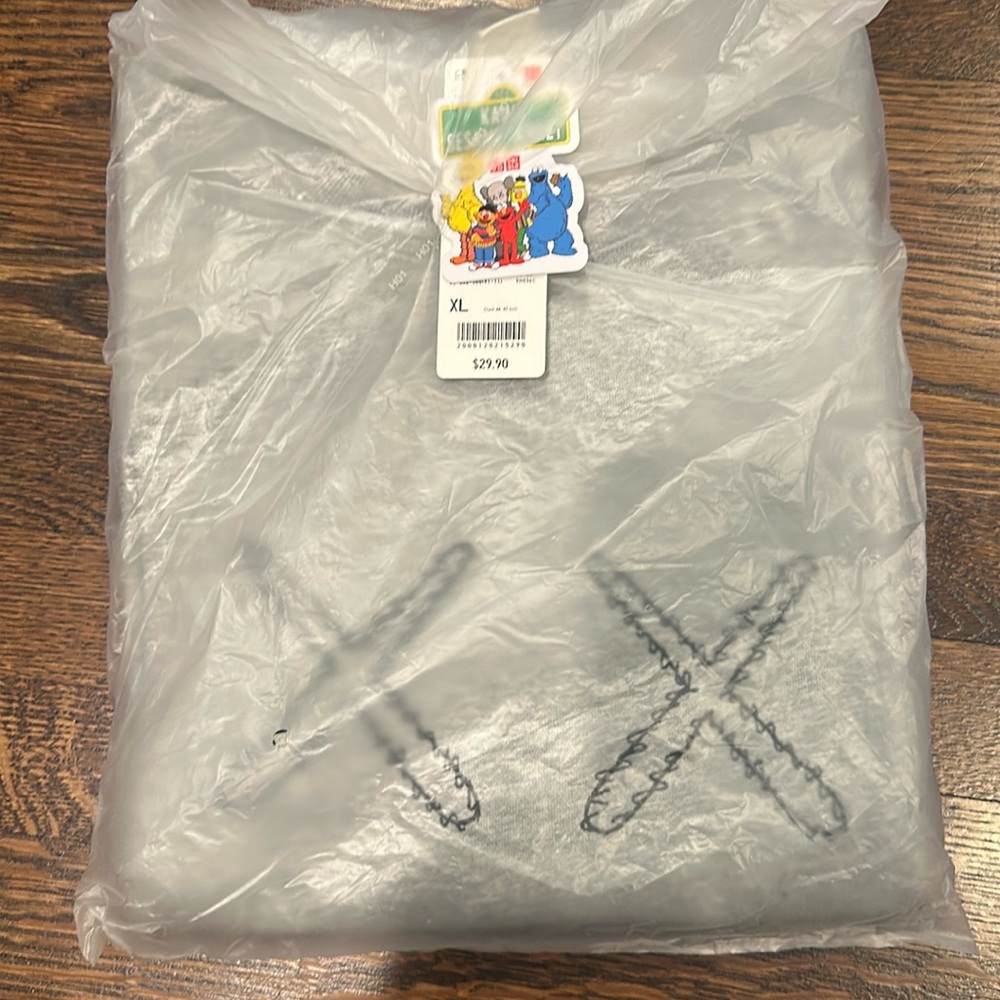 NEW w/ Tag. Original Packaging 
Uniqlo x Kaws Sesame Street Grey Sweatshirt